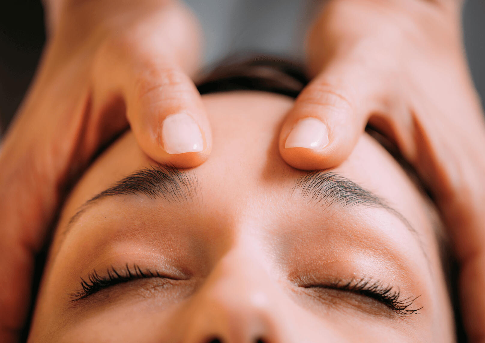 Photograph of indian head massage treatments (forehead being treated) provided by Ri Richards BSc, founder of Grangetown Reflexology - fully insured, DBS approved and highly trained to Level 6 Holistic Massage & Level 5 Clinical Reflexology and Aromatherap